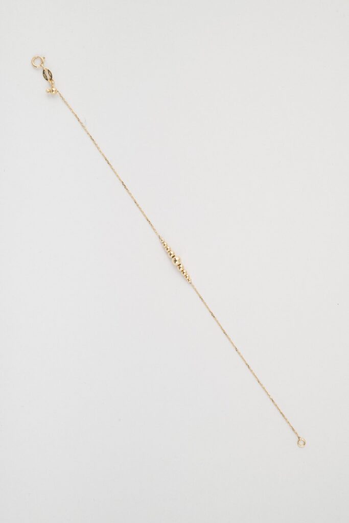 Bracciale in oro con centrale di palline a scalare