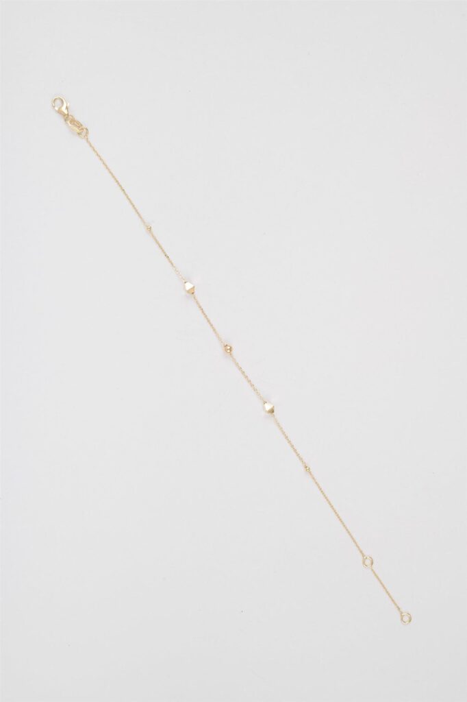 Yellow gold bracelet with octahedrons and small spheres